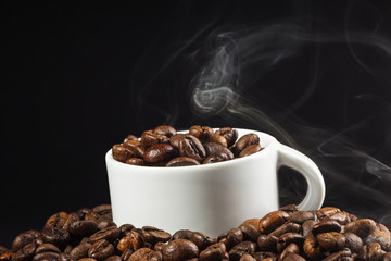 White cup and coffee beans