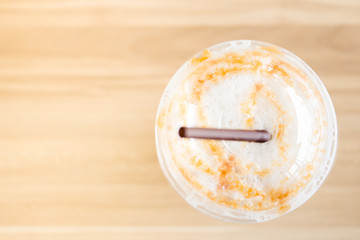 Iced caramel coffee shoot from top view.