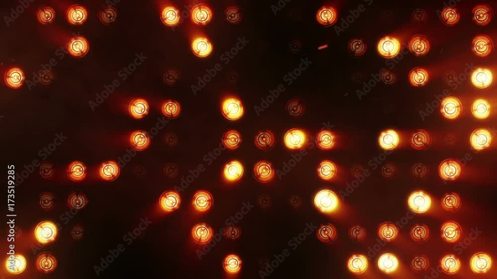 Poster bright floodlights flashing. orange. set of lights turning on and off. seamless loop. see more optio