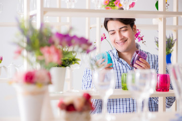 Young handsome man shopping in shop