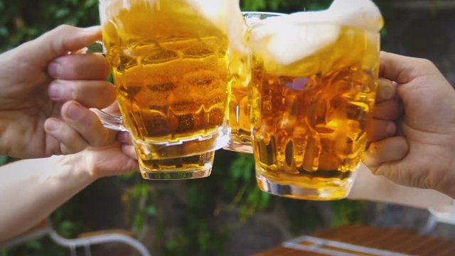 Slow motion beer toast among friends
