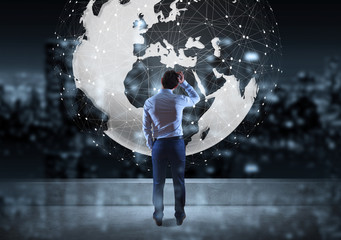 Businessman watching digital planet earth interface on a rooftop 3D rendering