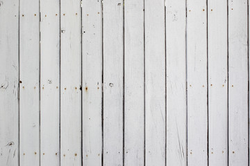 Old white wooden fence close up background.