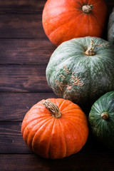 Autumn Pumpkin Thanksgiving Background - orange pumpkins over wooden table