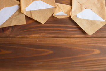 Blank card and envelope on old wooden background