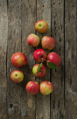 Apples on old wooden background