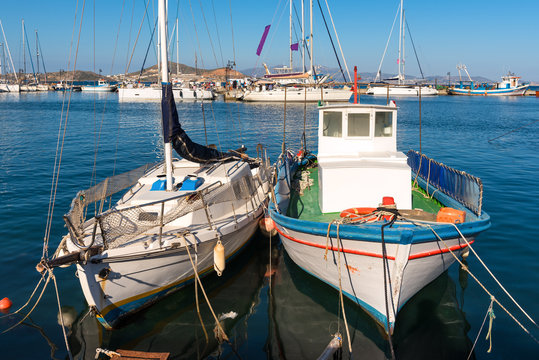  Fishing boats docked in the port of Naxos town (Chora). Cyclades Islands, Greece.