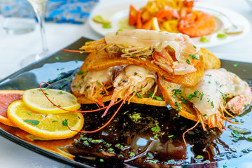 a dish of grilled shrimps with spice