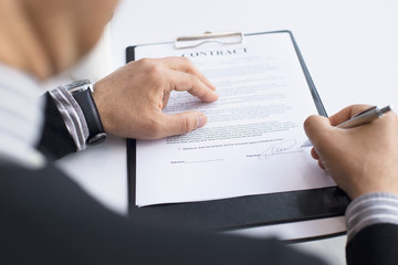 Businessman signing a contract