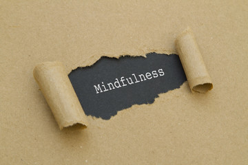 Mindfulness written under torn paper