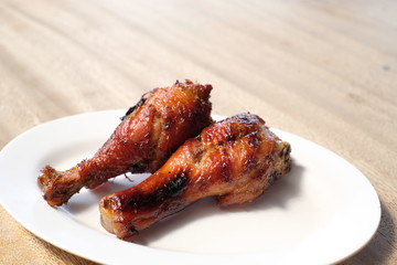Roasted Chicken Herbs in white dish - soft focus