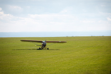 Fototapeta na wymiar Small propeller airplane private towing aircraft on the contryside field England