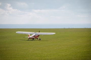 Fototapeta na wymiar Small propeller airplane private towing aircraft on the contryside field England