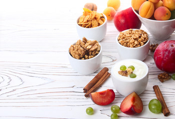 Granola, muesli, nuts, yogurt and fresh fruit