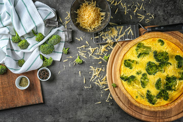 Composition with tasty broccoli quiche on table