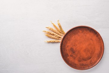 Clay pot. Dishes. On a wooden background. Top view. Free space.