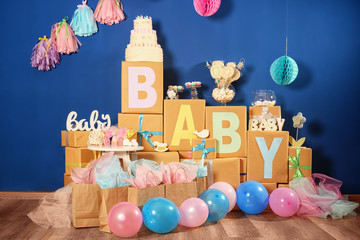 Composition with baby shower decorations and gifts indoors - obrazy, fototapety, plakaty