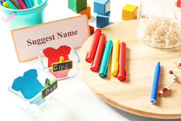 Game for suggestion baby name on table at shower party