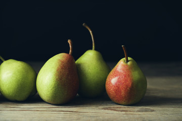 Ripe pears on wooden table