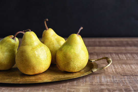 Ripe pears on metal tray