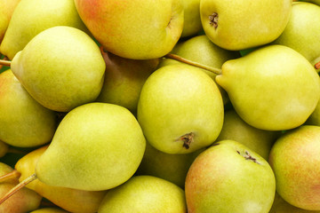 Delicious ripe pears as background
