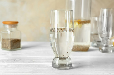Chia seeds in glass of water on kitchen table