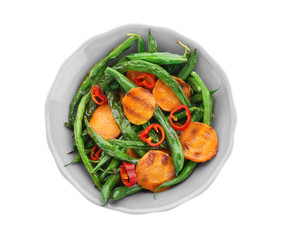 Bowl with delicious green beans, pepper and carrot slices on white background