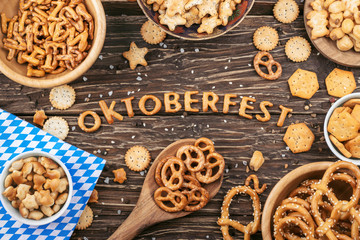 Oktoberfest lettering. Salty crackers, pretzels and others snacks
