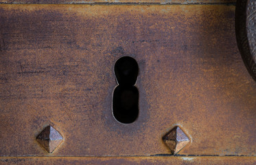 Closeup vintage door lock of external rusty iron