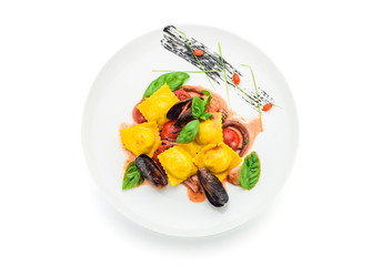 ravioli with crab and seafood sauce. Isolated on white background.