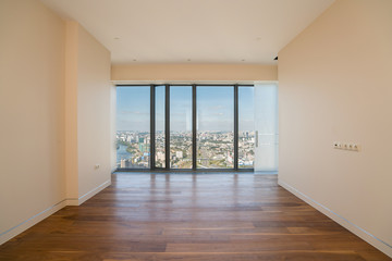 Empty  interior apartment with panoramic city view.