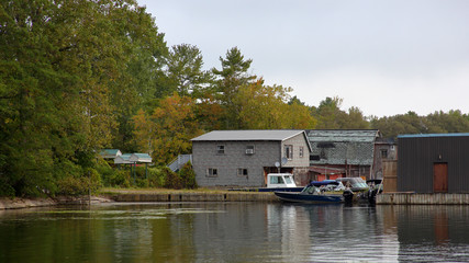 Small marina on the St Lawrence River with trees