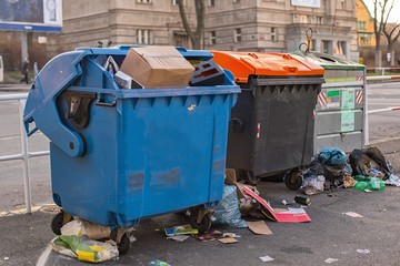 Dumpsters being full with garbage