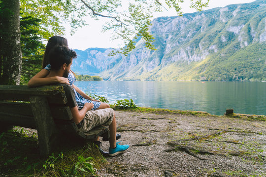 Couple Relaxing At Lake