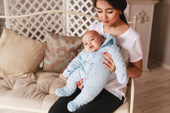 Young asian mother and baby in the room