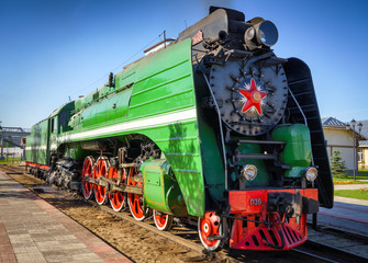 Old Soviet locomotive on the railway tracks