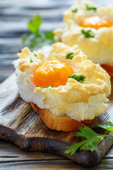 Baked eggs Orsini and parsley leaves.