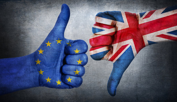  Hand with thumb up and down with the EU flag painted.  Symbol of Brexit and crisis in european union.