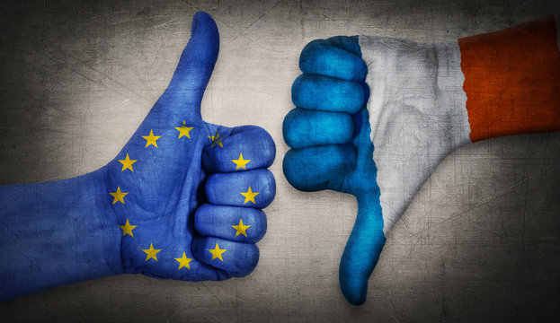  Hand with thumb up and down with the EU and French flag painted.  Symbol of Frexit and crisis in european union. France wants to leave the union.