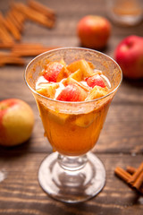 Apple cider cocktail with cinnamon and apple