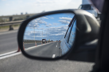 look in the rear view mirror of a car