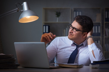 Businessman under stress smoking in office