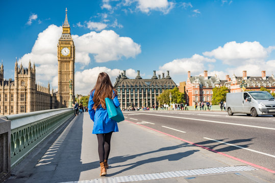 London City Urban Lifestyle Tourist Woman Walking. Businesswoman Commuting Going To Work On Westminster Bridge Street Early Morning. Europe Travel Destination, England, Great Britain, UK.