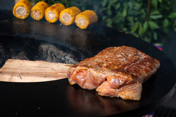 delicious beef steaks on the grill with flames