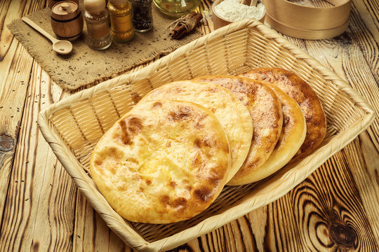Traditional Georgian bread - khachapuri and Kolkh khachapuri on the table.Homemade baking. Flat lay, overhead.Khachapuri with cheese,georgian khachapuri megruli with cheese,Traditional Georgian pie