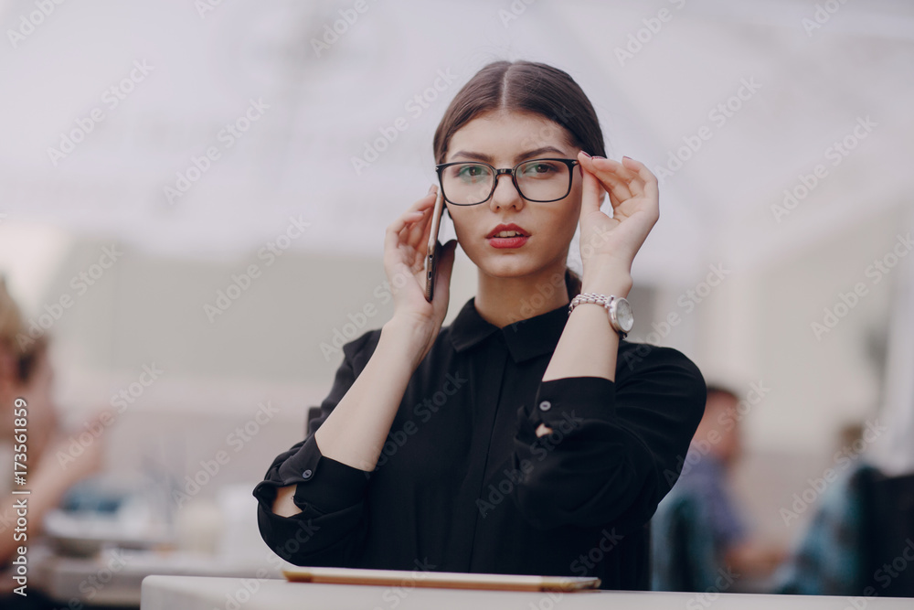 Wall mural beautiful brunette with glasses