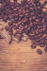 Coffee beans on wooden background
