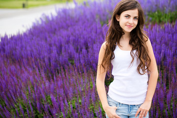 Young beautiful girl on lavender background.