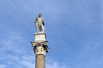 Column of Hercules on al Alameda in Sevilla, Span. Original roman column in corinthian order with statue of the hero with blue sky