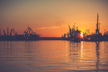 Amazing foggy sunrise over the shipyard in Gdynia